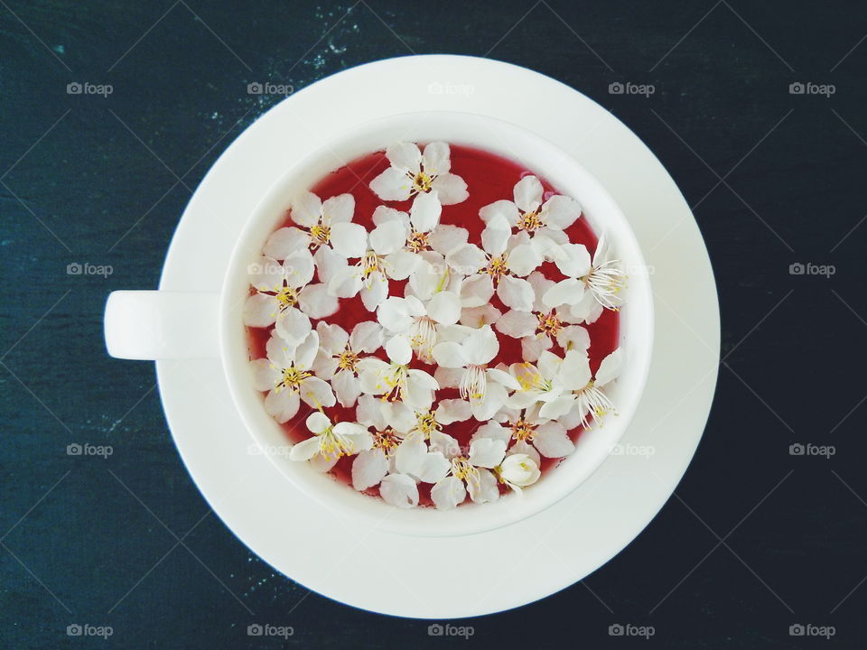 Cherry blossom tea. Cherry blossom tea on dark background