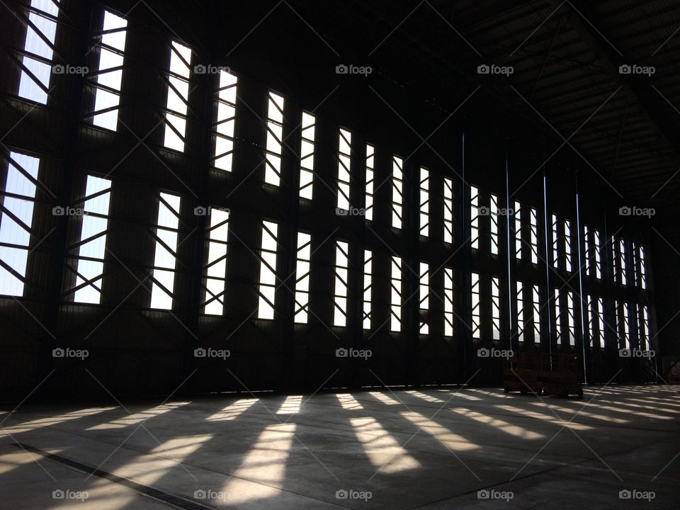 Sunlight coming in through hangar doors. 
