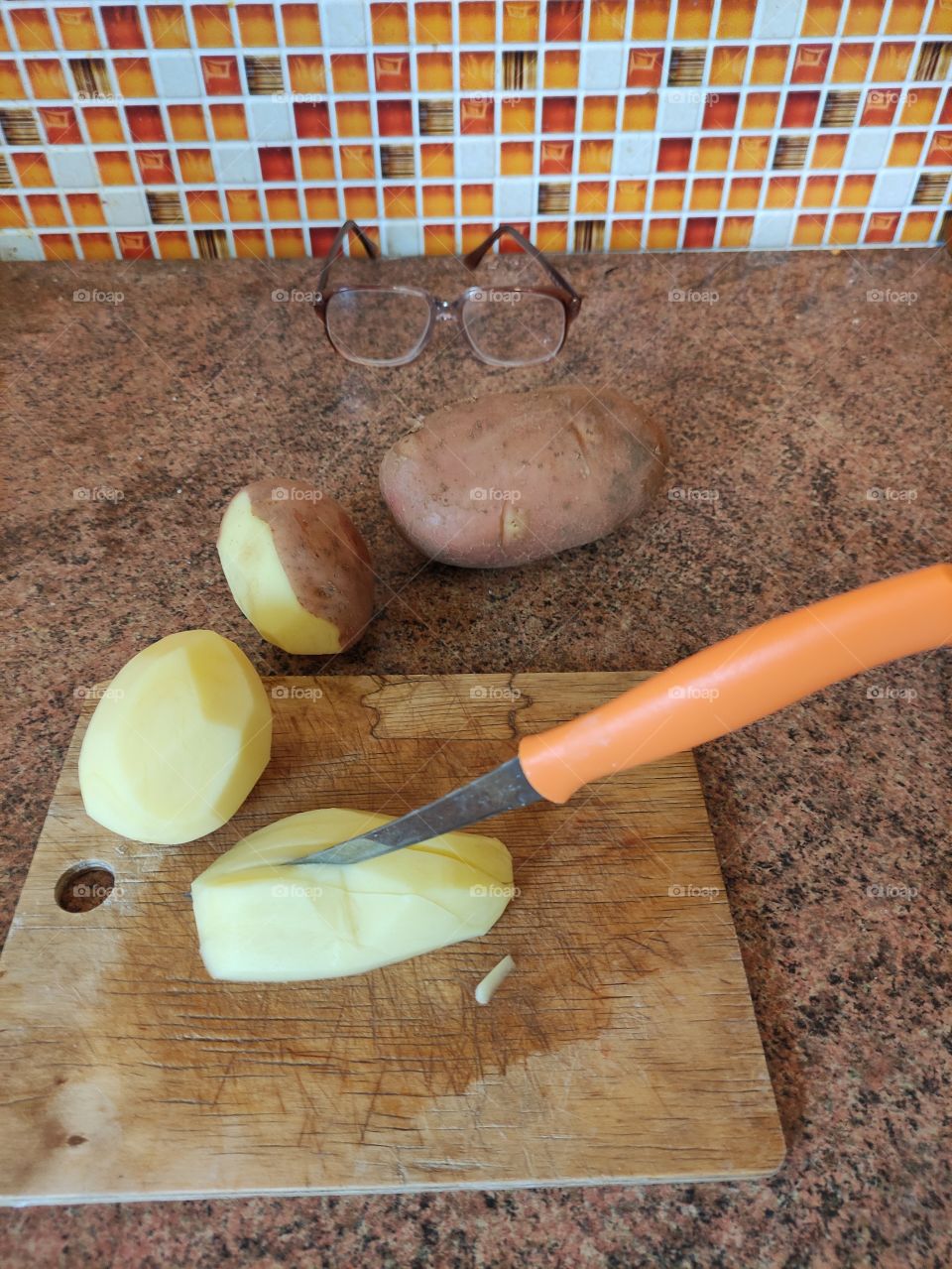 Peeling potatoes for soup.