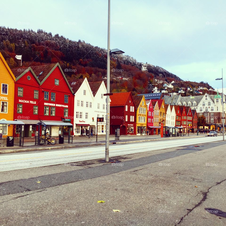 Bryggen in bergen with the mountains in the background 