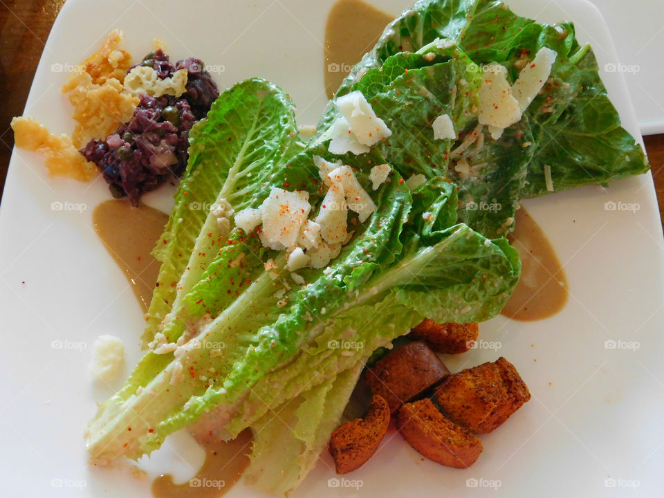 Romaine lettuce leafs sprinkled with goat cheese, salt, paprika,toasted croutons,savory mustard dressing with a side of toasted cheese, pickled beets and green peas! So tantalizing and crispy!