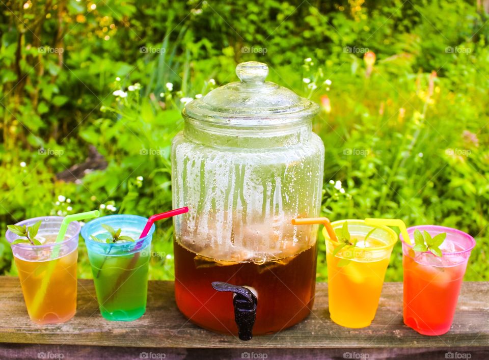 Variety of colorful juices in drinking glass