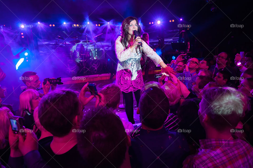 Swedish superstar Carola Häggkvist performing on stage in a nightclub in Malmö.