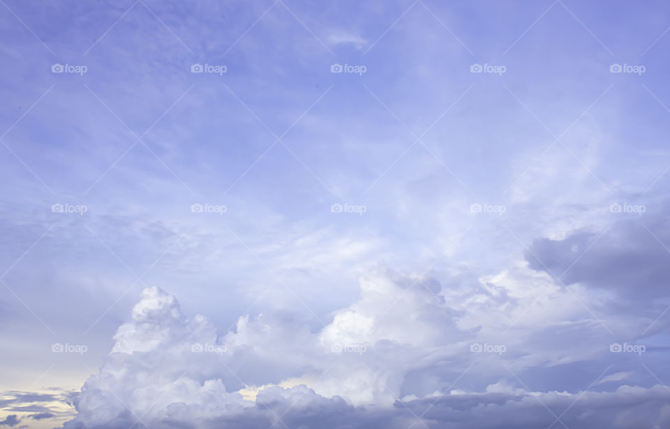 The beauty of the sky with clouds and the sun.