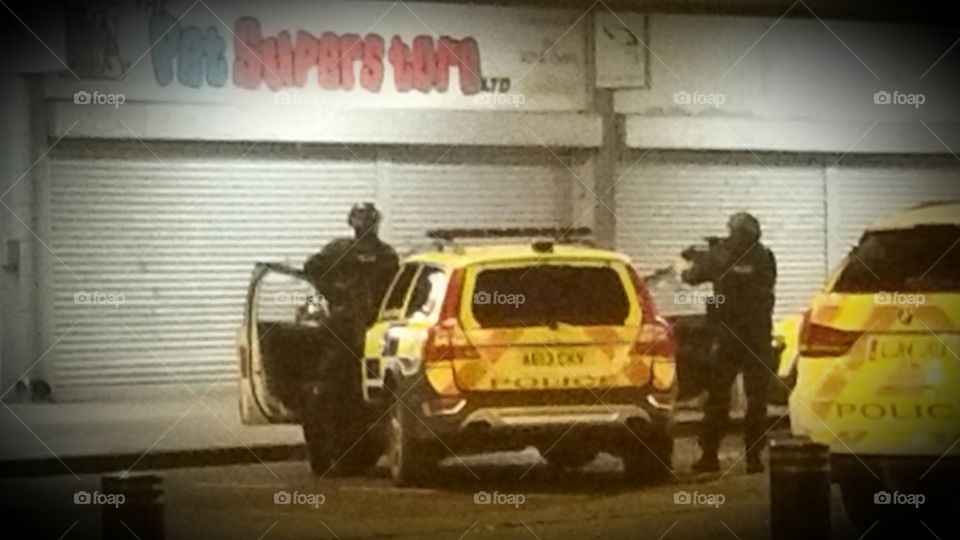 Armed British police in hostage situation