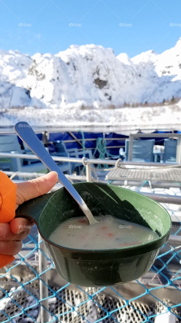 Having fish soup on the boat