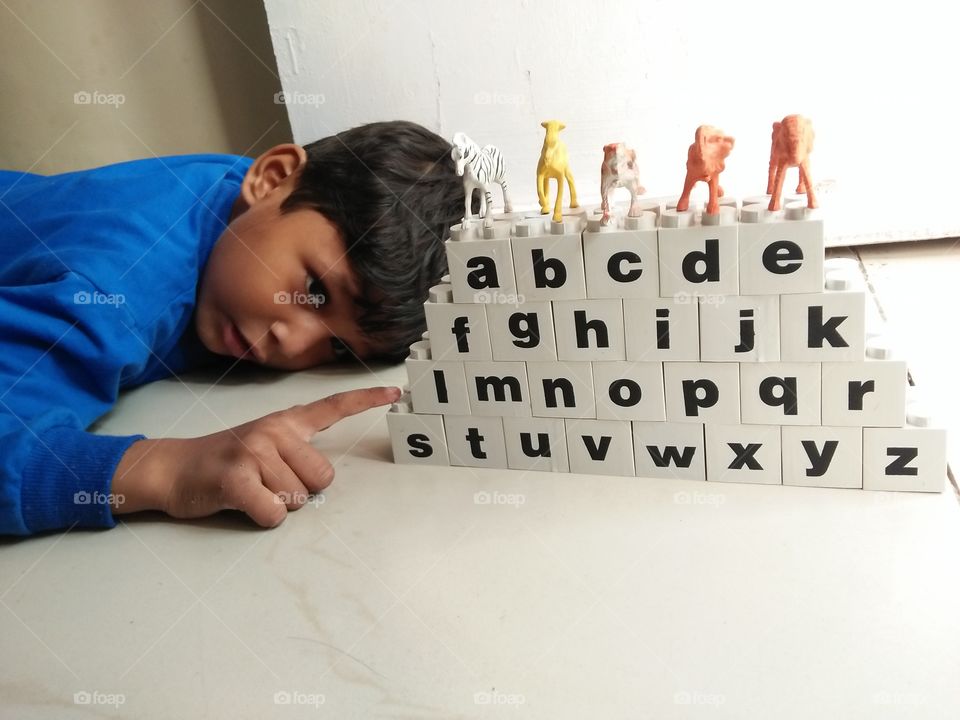 child is learning | A B C D | Learn with fun