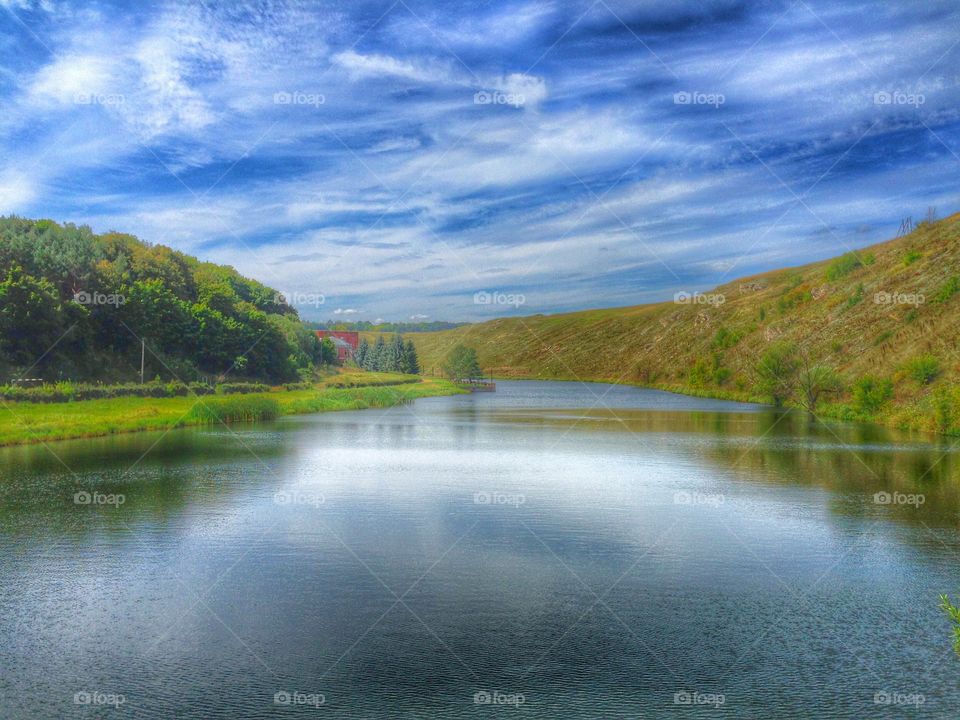 Blue sky over river