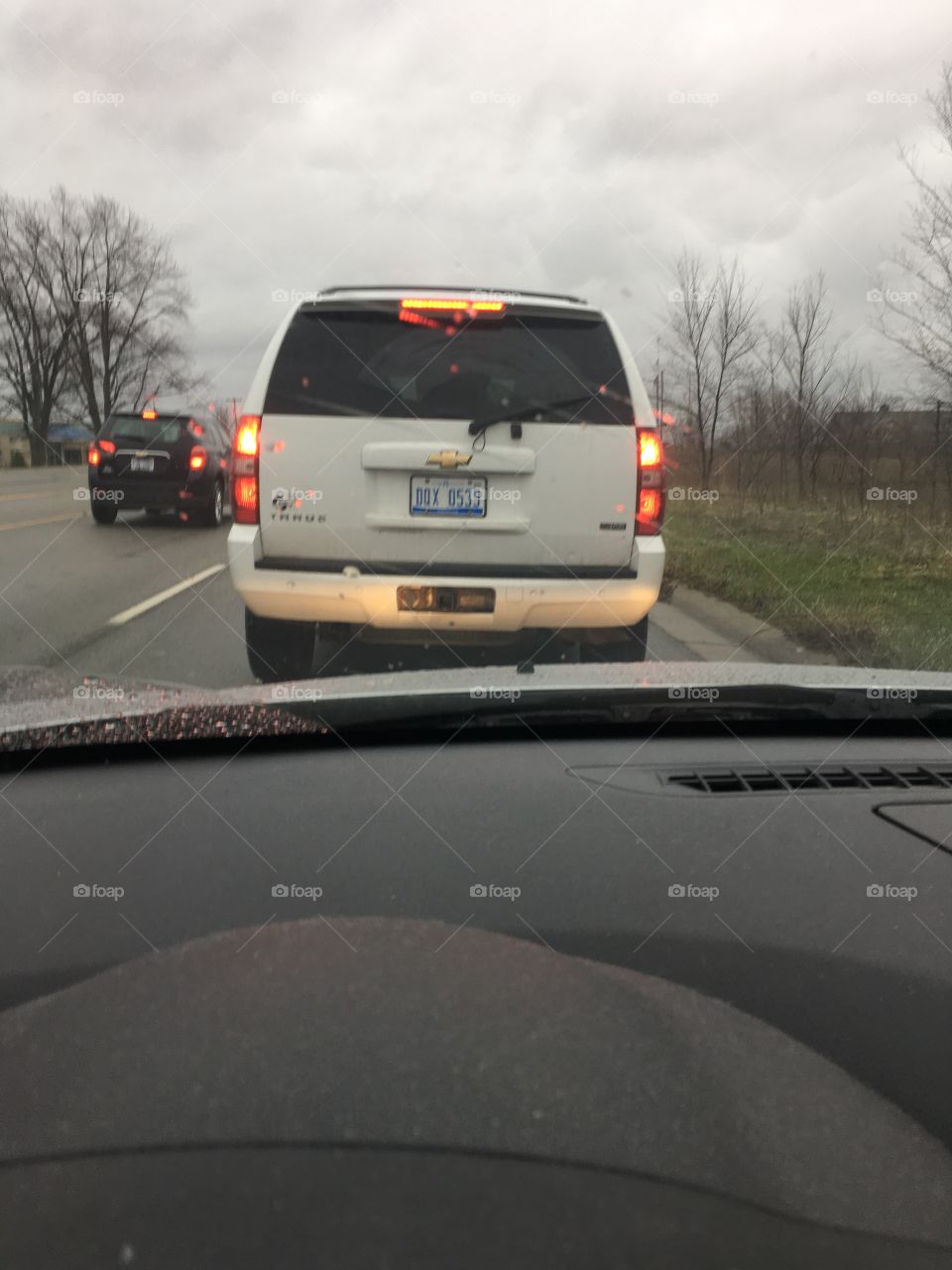 Stuck in traffic on a cloudy day.