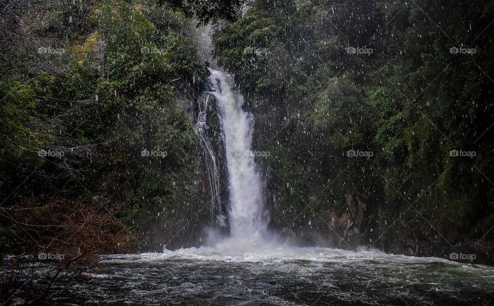 Waterfall in a snow day in winter 