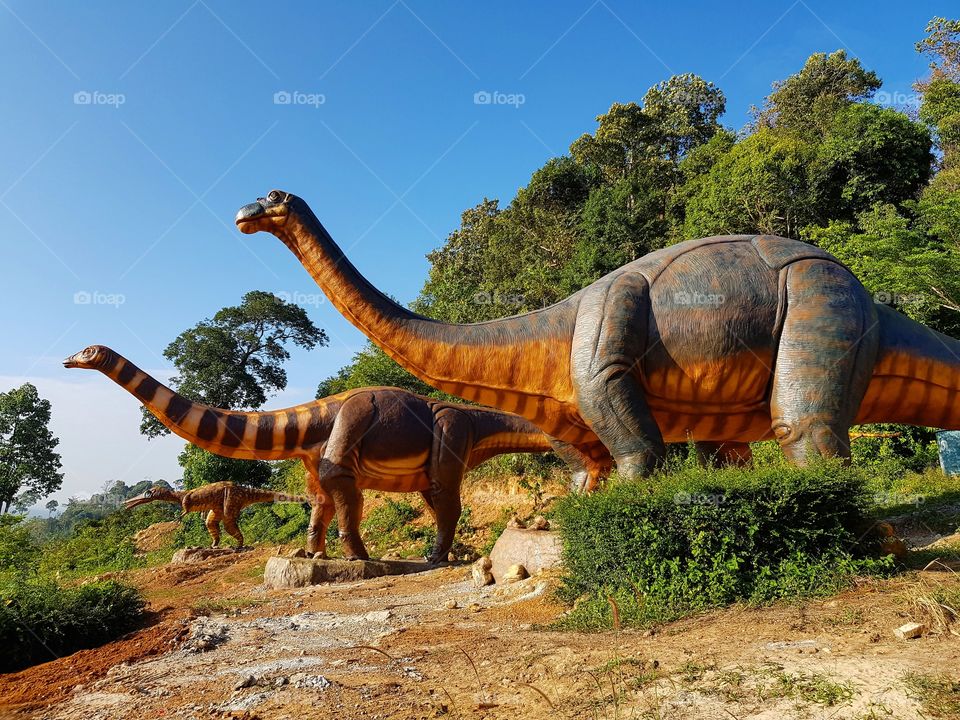 The dinosaur statues in the park