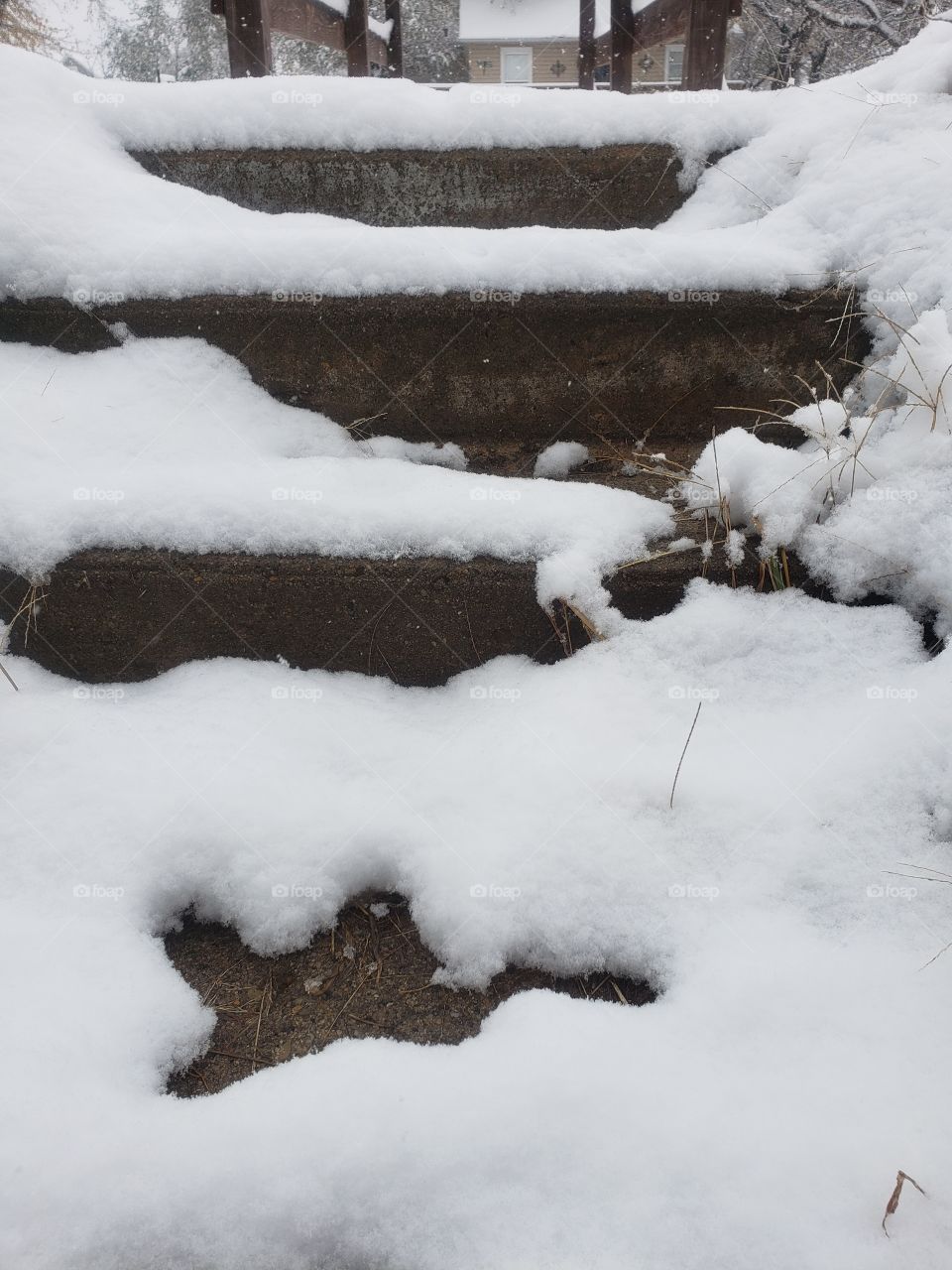 snow on concrete steps