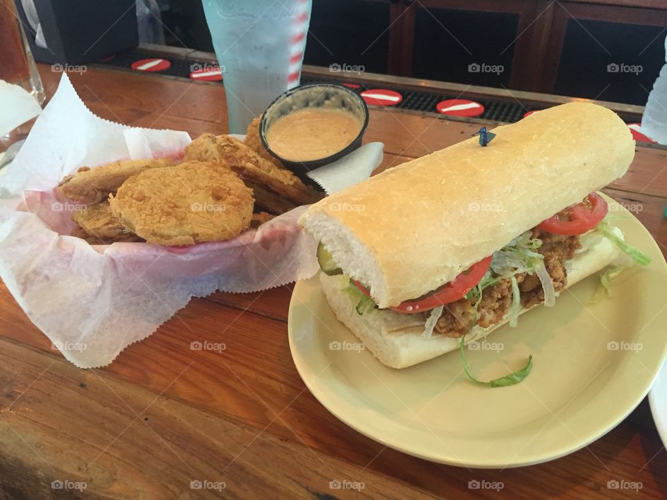 Mahoney’s Fried Oyster Po Boy and Fried Green Tomatoes on Magazine St. New Orleans, Louisiana. 