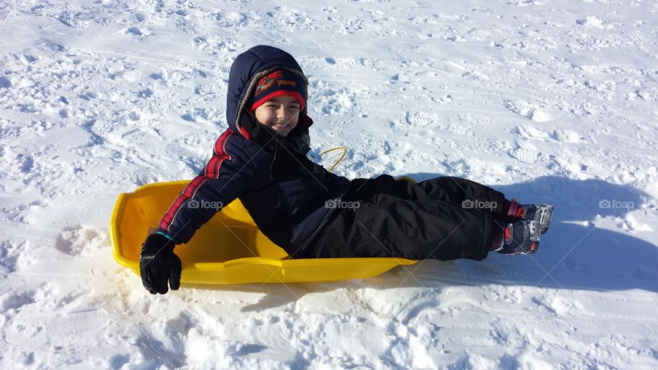 Fun in the snow. sledding  in Wisconsin