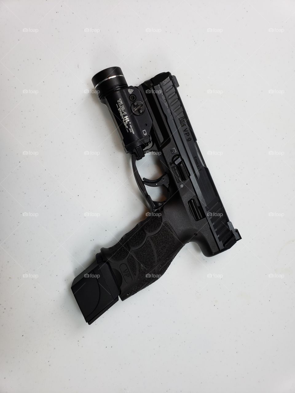 HK VP9 with a 20 round magazine and light