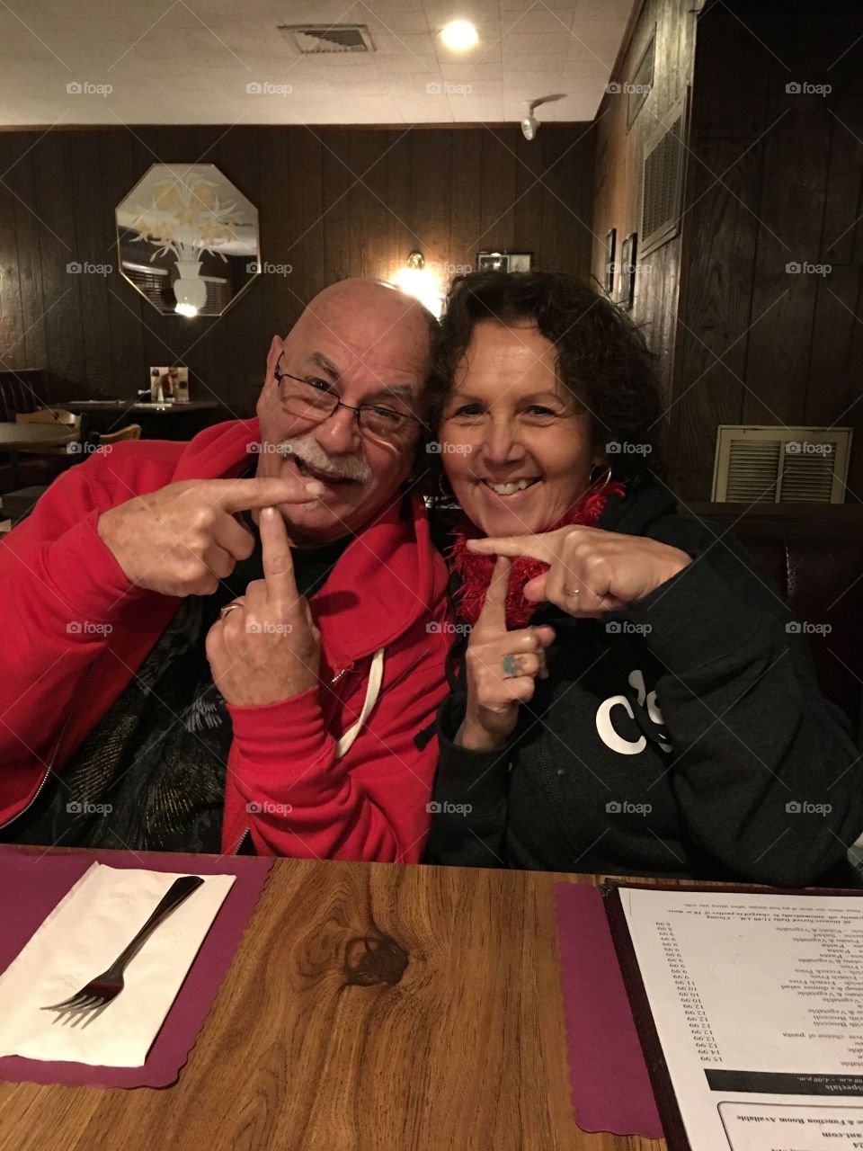 Happy couple sitting in restaurant