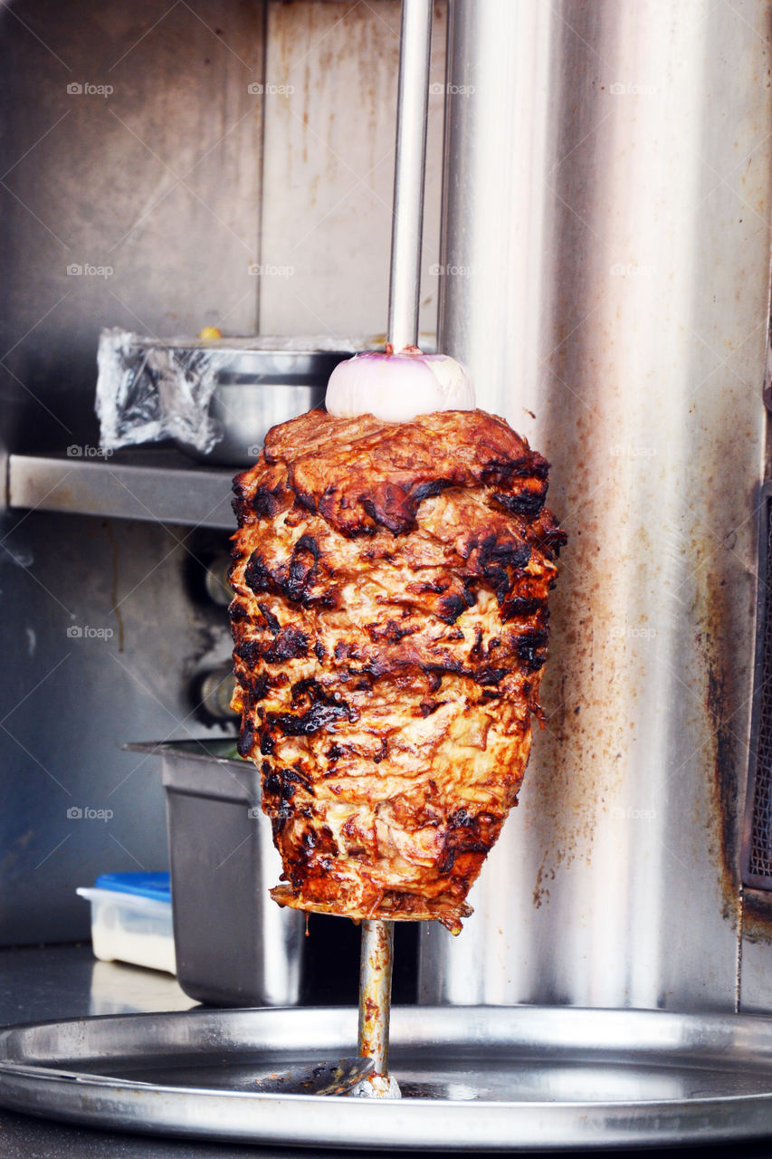 kebab on grill. kebab rotating on grill
