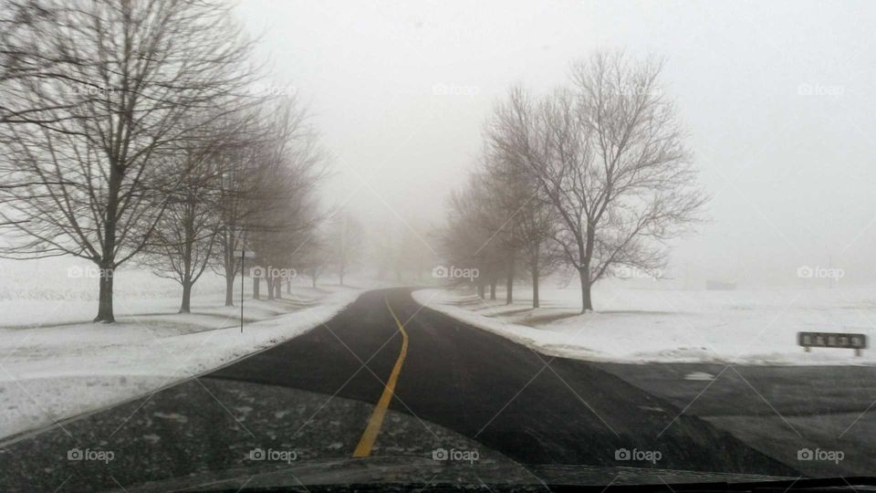 driving to work. snowy drive on campus