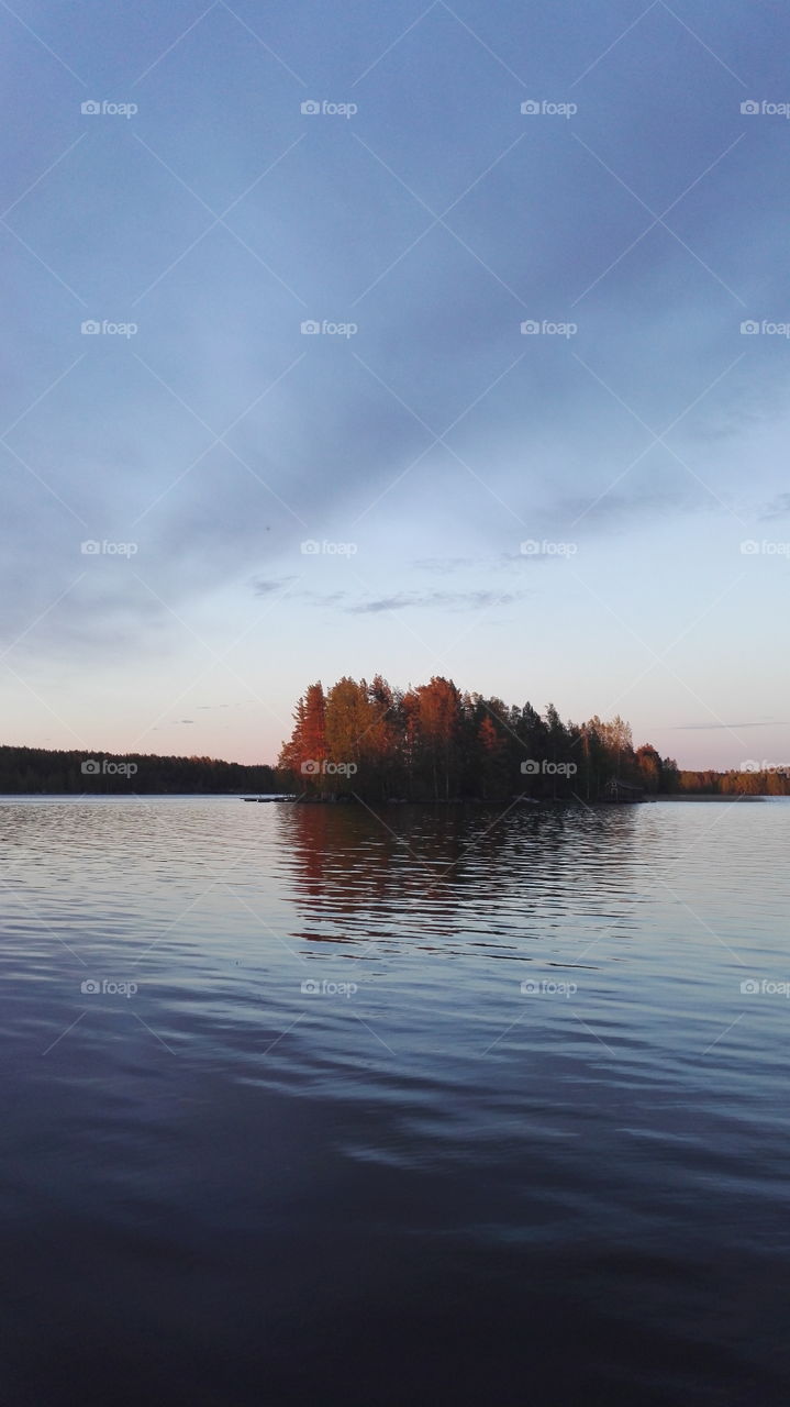 Calming Lake landscape in Finland relax water calming evening sky. Illustration blue sky blue Lake.