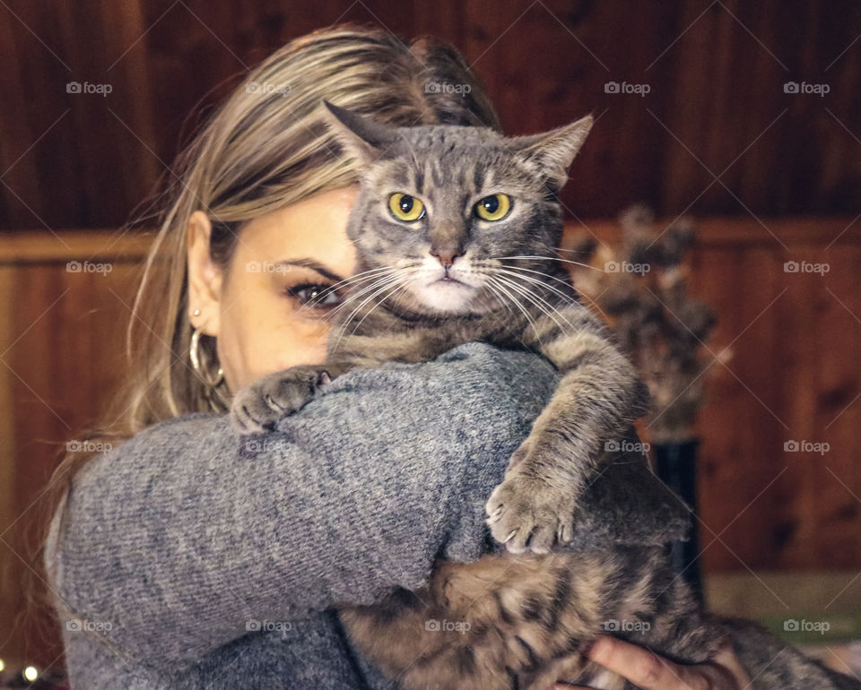 Photo of a woman holding a cat
