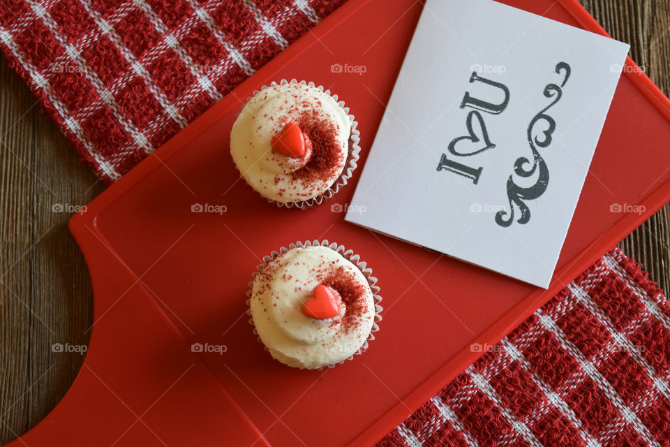 Red velvet cupcakes with Valentine's day sentiments