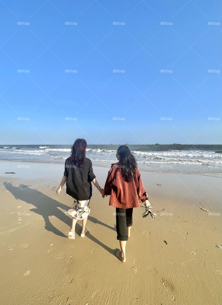 Beautiful connection of friendship in beautiful beach