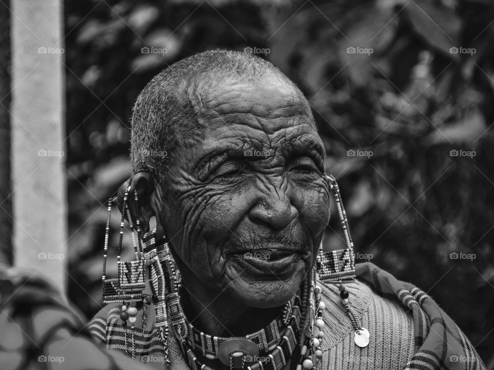 BIBI.... Swahili word that means a mature married woman.
Taken at a dowry ceremony in basil town, Kajiado County, Kenya the woman in the picture was amused by the mood of the guests singing and dancing at the ceremony.