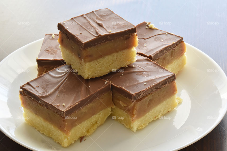 Millionaire's shortbread, caramel shortcake, or millionaire's slice. Copy space is on the right side.
