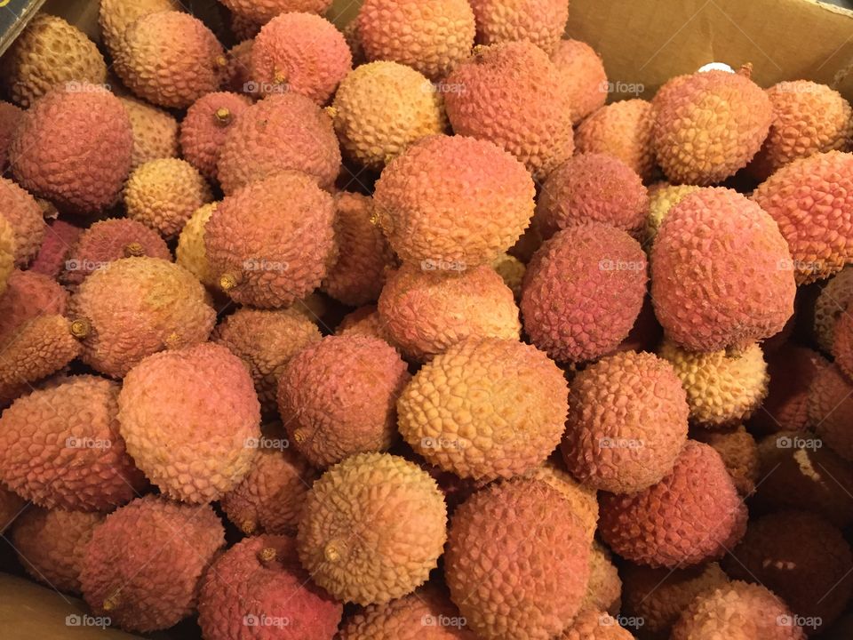 Litchi fruit from China displayed in a supermarket.