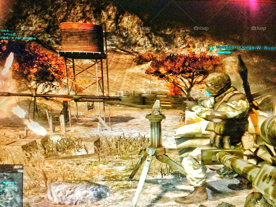 Screenshot of a violent military first person shooter video game