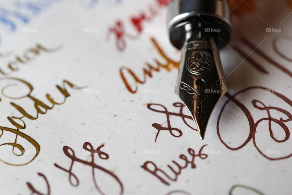 Fountain pen nib and writing close up 