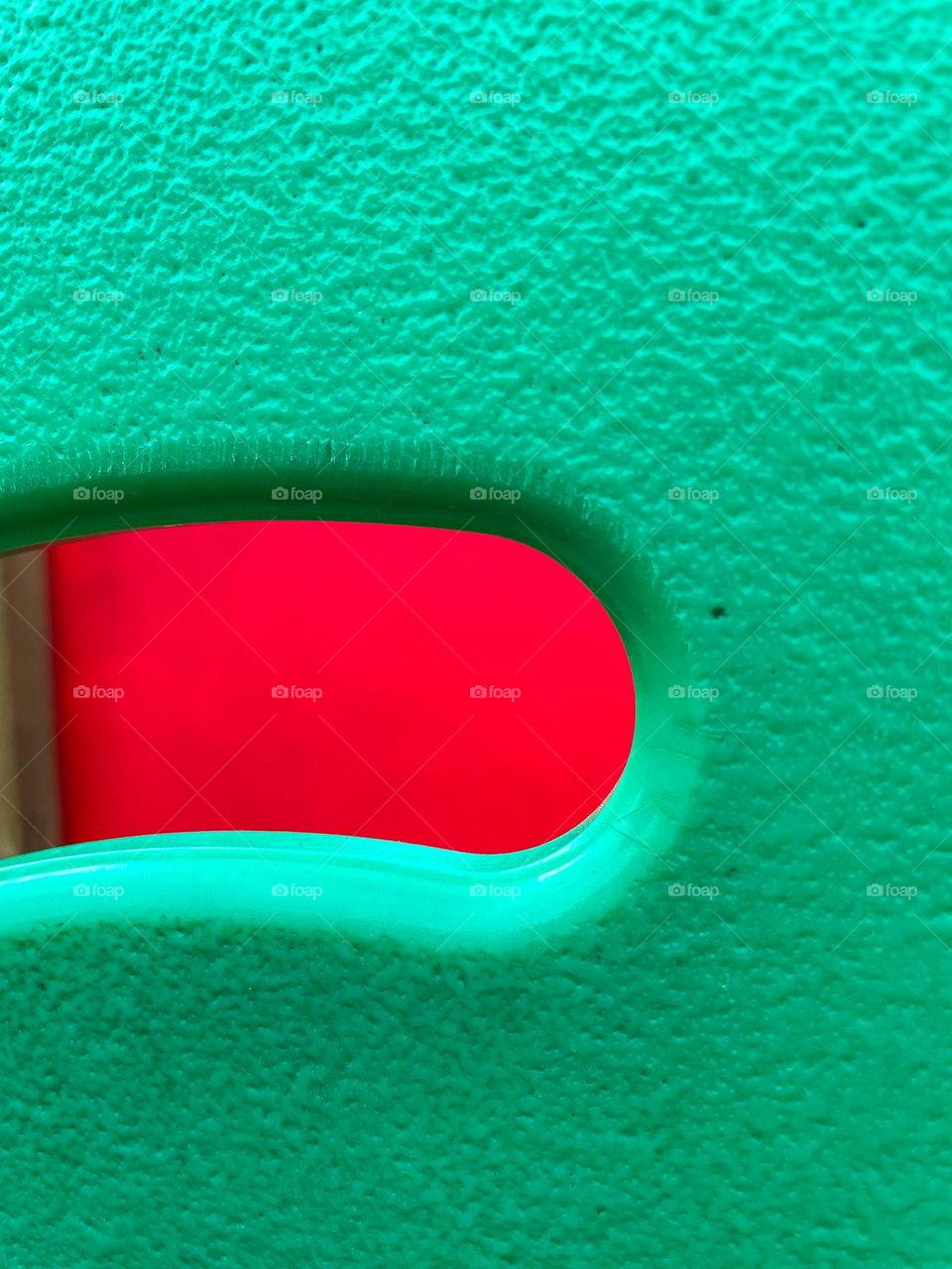 A colorful composition featuring textured green and vivid red, capturing the beauty of contrast in an everyday object.