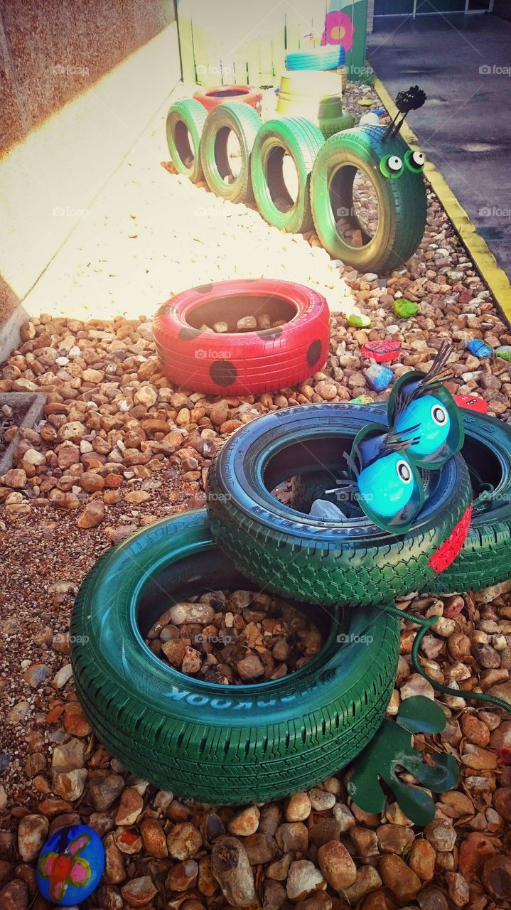 playground school elementary tires art frog worm ladybug rocks south Texas warm weather
