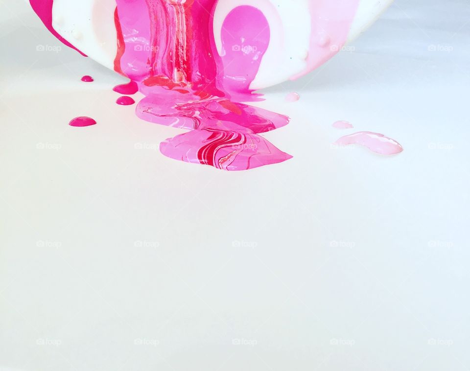 Close-up of a melting ice cream on white background