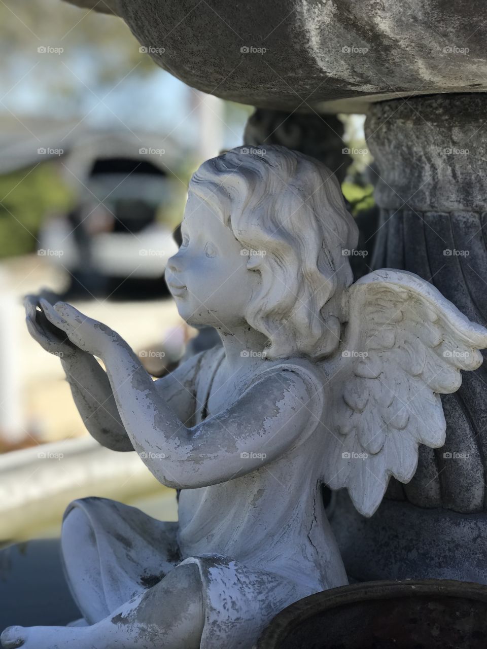 Statue- people fill their homes with many adornments both inside and outside. Many of them give the home a gorgeous look. This little angel sits outside grandpa’s home by the fountain. #NoFilters