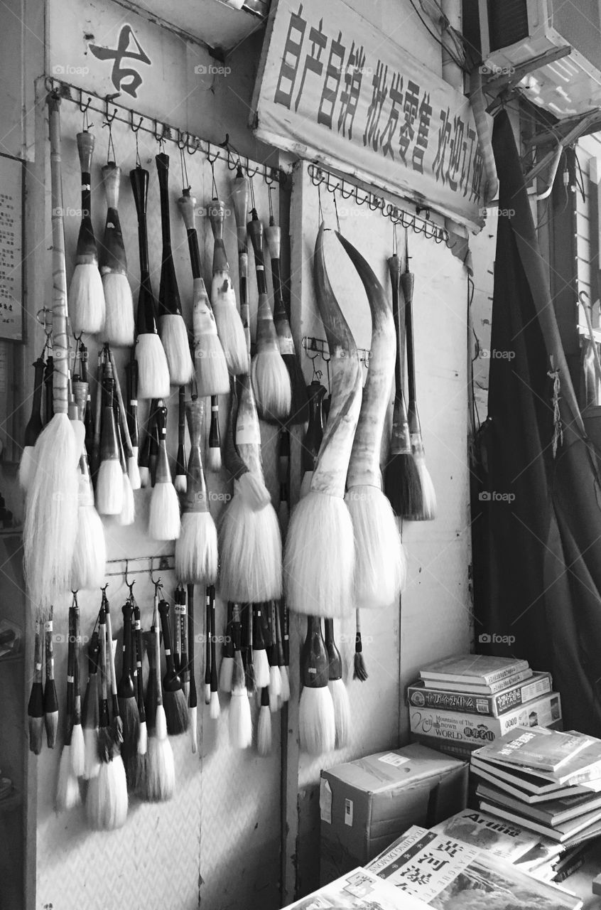 Paintbrushes Hanging in Art Store at Dafen Oil Painting Village in Shenzhen, China