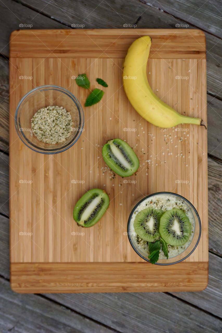 Overhead view of kiwi and banana hemp smoothie