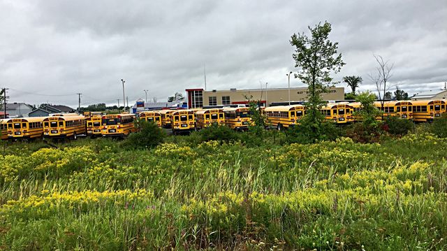 Buses are getting ready for school at the garage 
