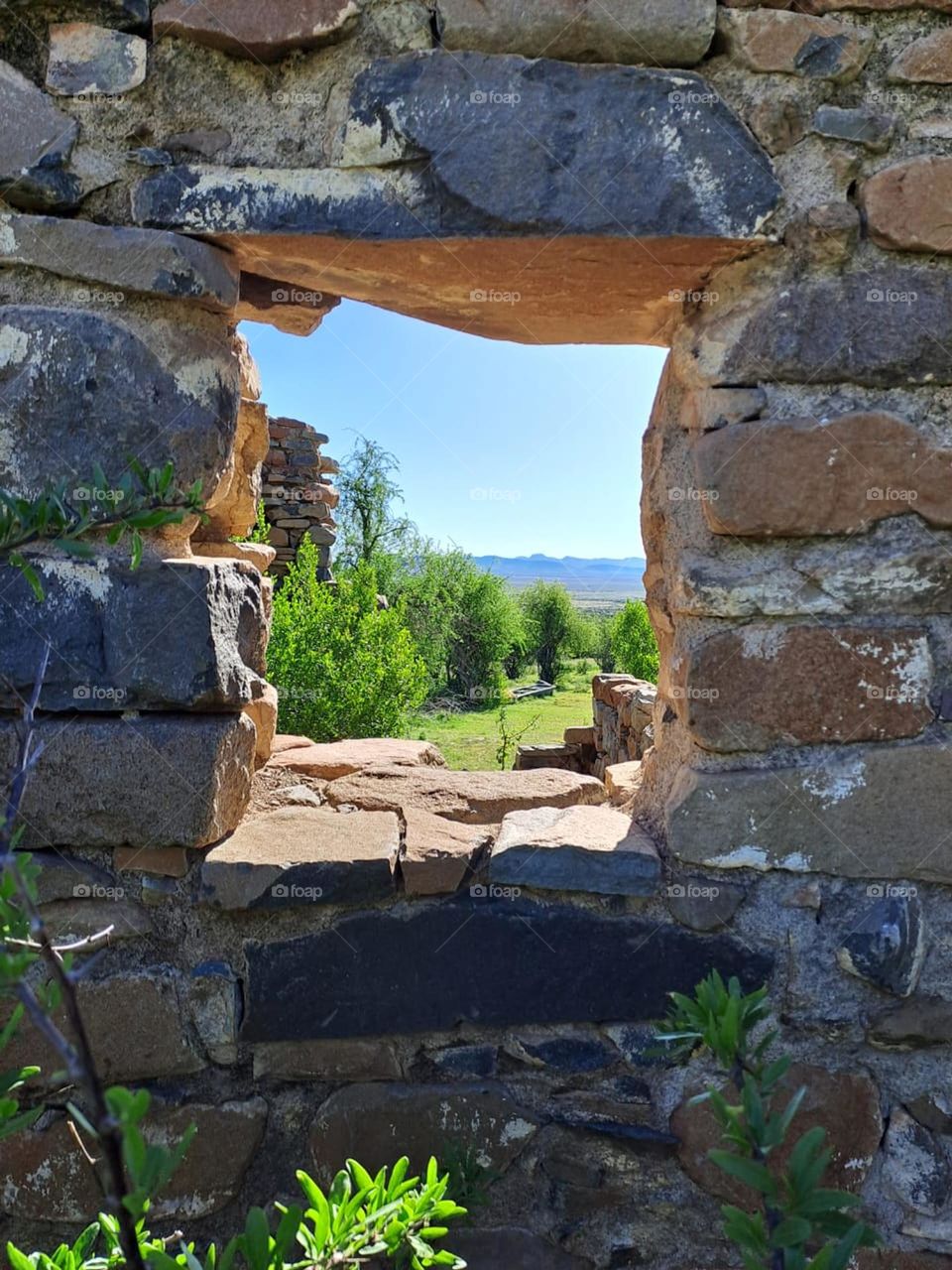 Karoo Farm view through a ruin window.