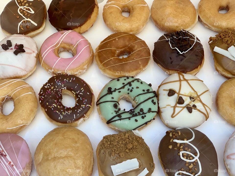 Round, colorful glazed donuts from above, delicious food, dessert time, sweet break, street pastries 