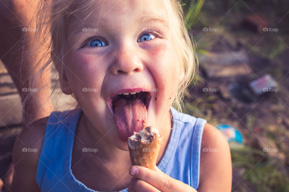 Little girl enjoying ice cream