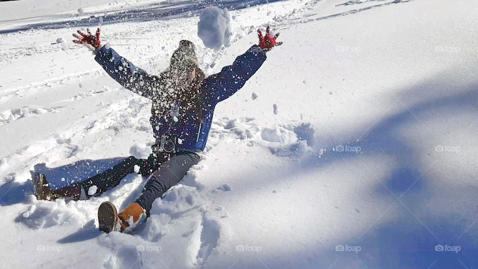 snow angel, snow fight, throwing snow, girl enjoying the snow