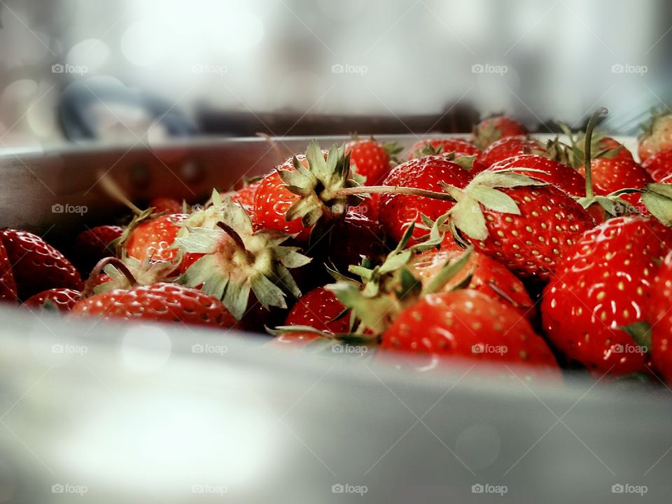 red strawberries in a cup