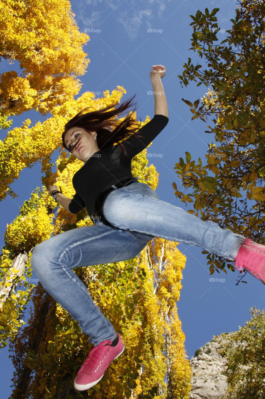 Jumping seems to be closer to brushing the leaves of the tall trees. A perfect angle to leave the impression that I am brushing the tops of the trees.