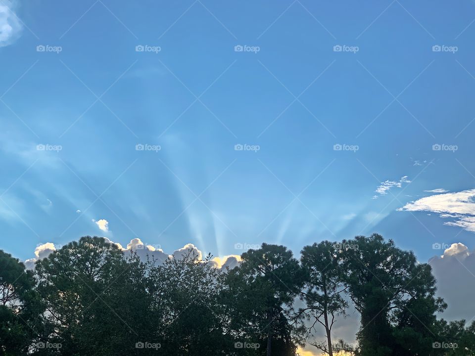 Bright blue sky with beautiful sun rays.