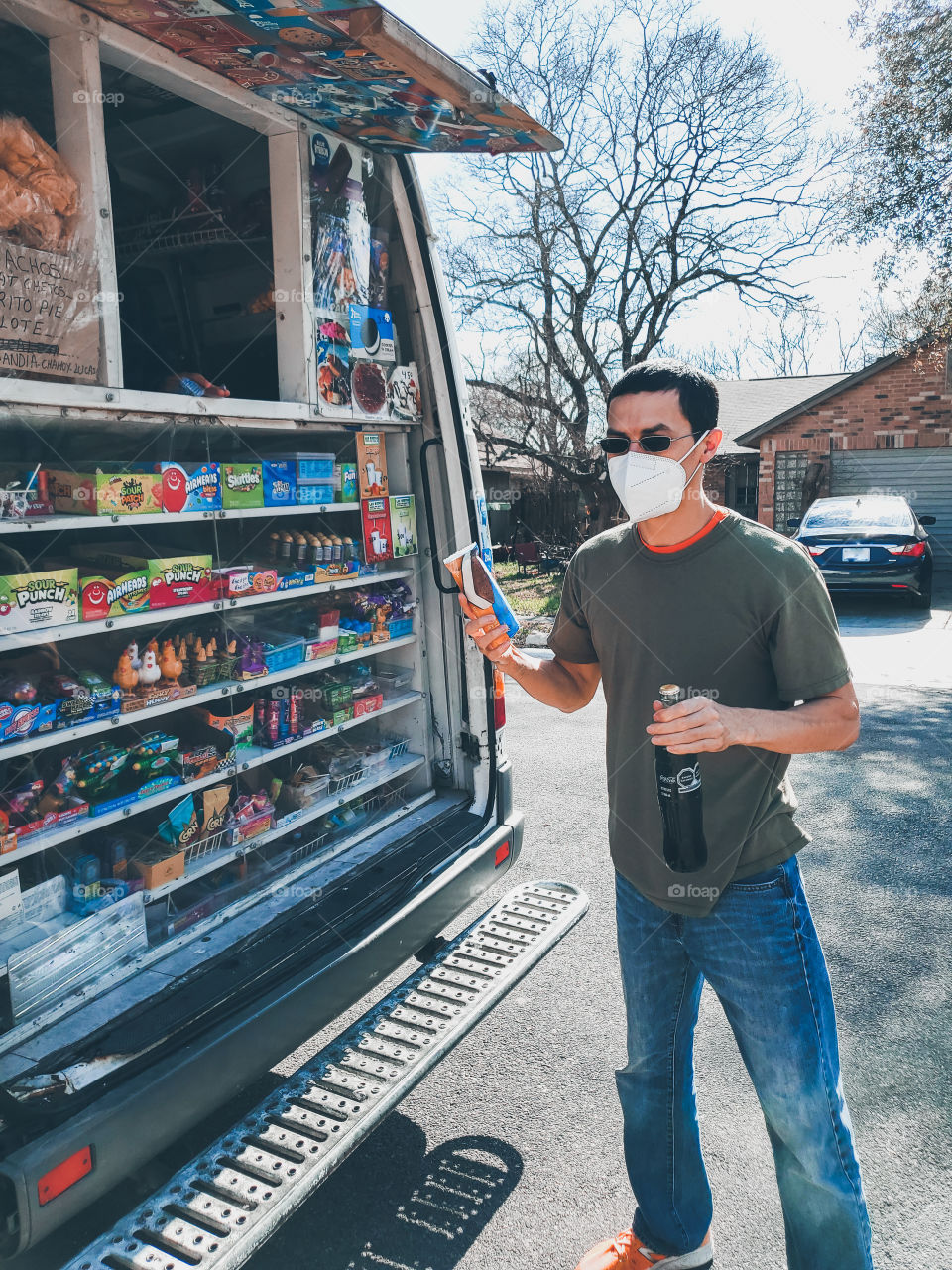 Man buying a bottle of Coca-Cola from the ice-cream truck during the 2021 pandemic no.1