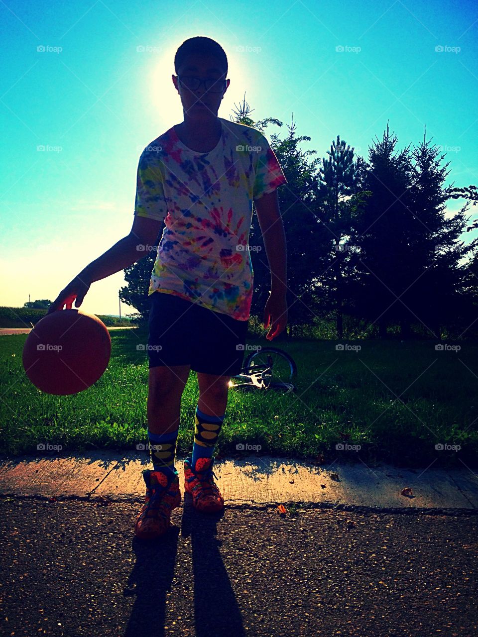 Basketball shadows . Love watching him play, and the glow of the sky behind him.