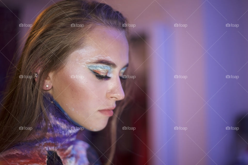 Body art, painting on skin. Beautiful brunette, profile