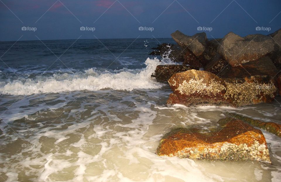 Waves crashing on rocks