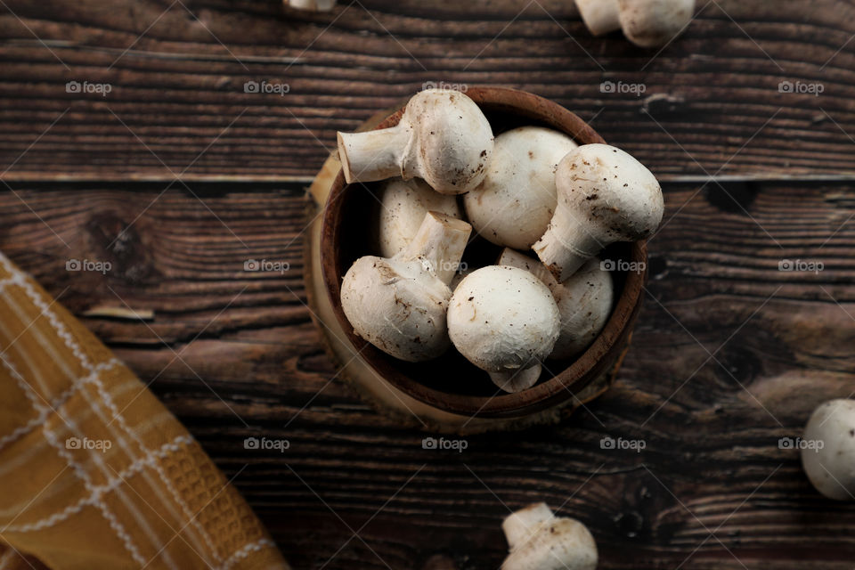 fresh organic button mushroom in a sudden bowl